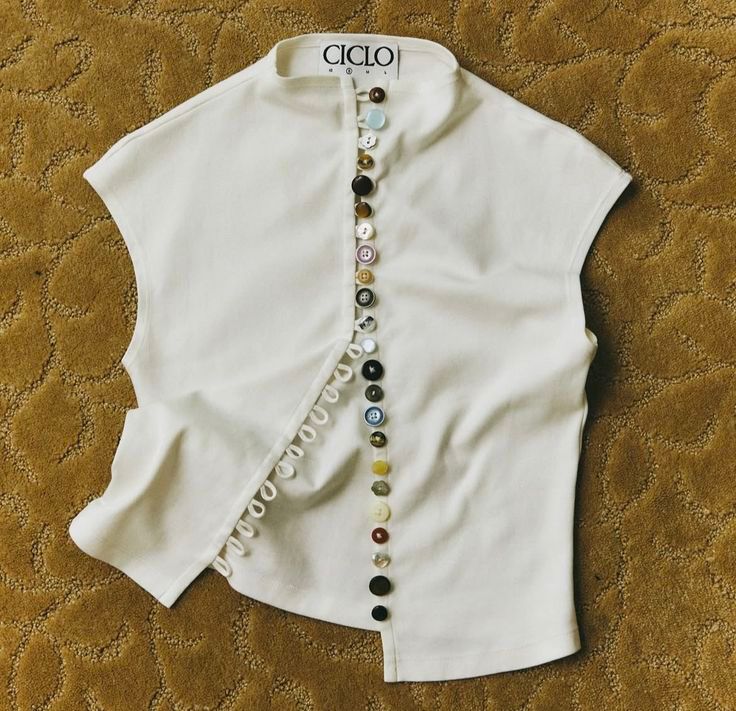 White top with colorful buttons